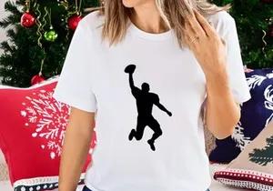 American football player catching a ball in mid air silhouette