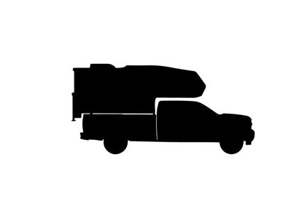 Silhouette of a delivery truck with cargo on top