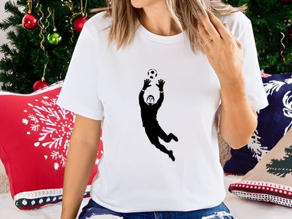 Soccer goalkeeper in action diving to catch a ball in mid air