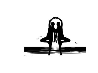 Silhouette of two people in yoga pose at sunset