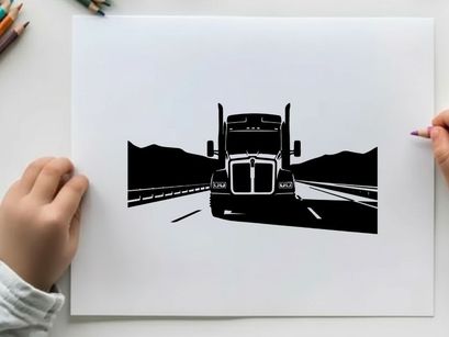 Silhouette of a semi truck driving on a highway with mountains