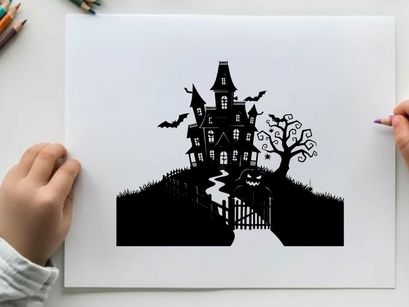 Spooky silhouette of haunted house on hill with jack o lantern