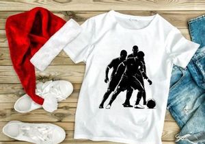 Silhouette of three soccer players in action with a ball