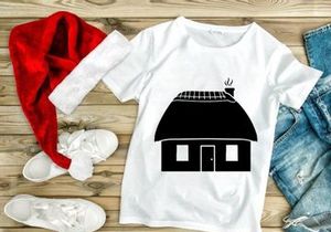Thatched roof cottage with smoking chimney