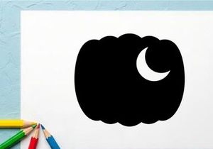 Silhouette of a pumpkin with a crescent moon in the night sky