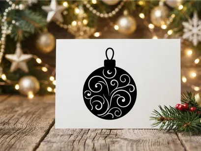 Black Christmas bauble ornament with white swirl pattern isolated on white background