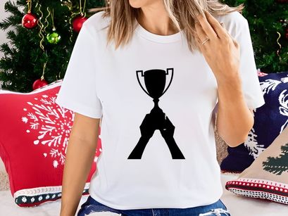 A person holding a trophy cup in a victorious gesture of achievement and success