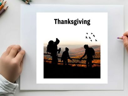 Thanksgiving silhouette of family on a hill watching birds fly