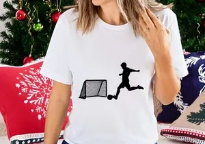 Soccer player kicking ball into goal in a dynamic motion silhouette