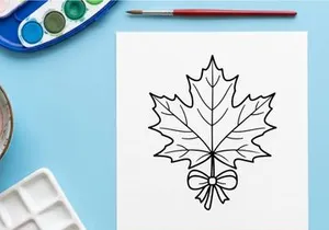 Cozy autumn scene with a maple leaf and bow. Seasonal fall decor for home or outdoor settings.