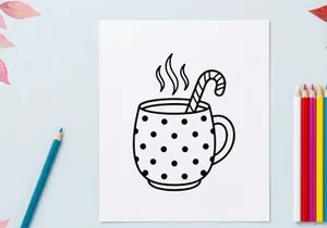 Steaming hot coffee in polka dot mug with candy cane stirrer for festive Christmas morning