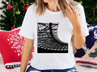 Black and white photo of a large industrial or sports venue roof structure