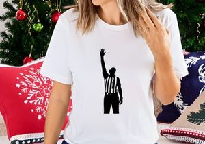A black silhouette of a referee signaling a call in a sports game