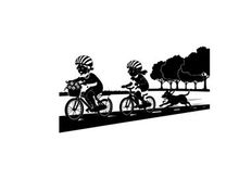 Silhouette of two cyclists and dog on a road