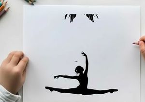 Silhouette of a dancer in a dramatic pose