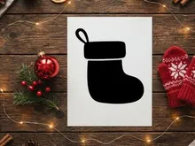 Black silhouette of a Christmas stocking isolated on a white background