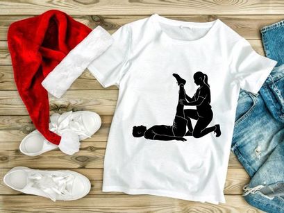 A woman assisting a man with a leg stretch exercise on the floor