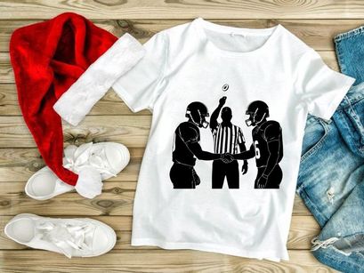 American football referee and players in action during a game