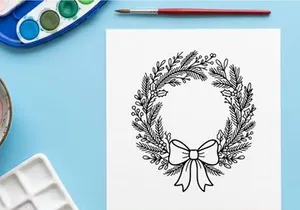 Hand drawn Christmas wreath with pine branches and bow, black and white line art illustration