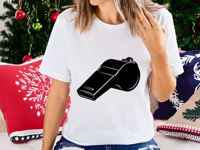 A black plastic whistle with a distinctive shape and three horizontal lines