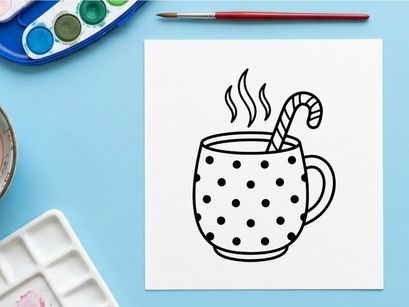 Steaming hot coffee in polka dot mug with candy cane stirrer for festive Christmas morning