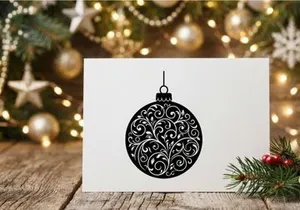 Black and white Christmas bauble ornament with elegant floral swirl pattern design