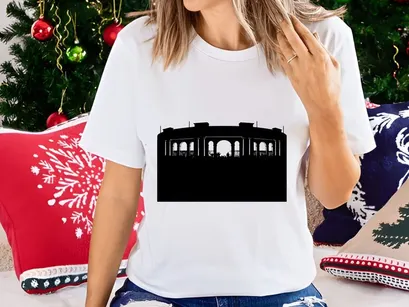 Concert silhouette at dusk with large crowd and architectural structure