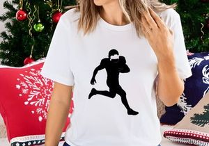 American football player running with ball in hand silhouette
