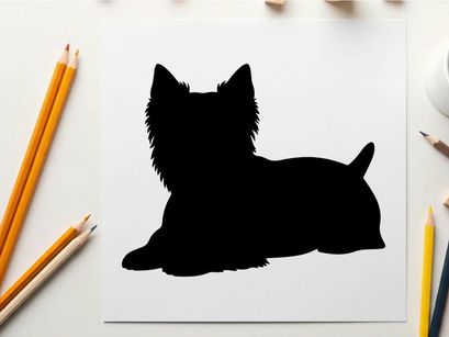 Silhouette of a small black dog lying down calmly