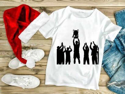 Silhouette of a group of people celebrating with a trophy