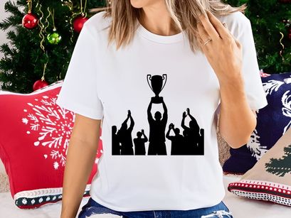 Silhouette of a group celebrating with a trophy