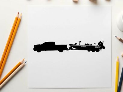 Silhouette of a pickup truck towing a fishing boat