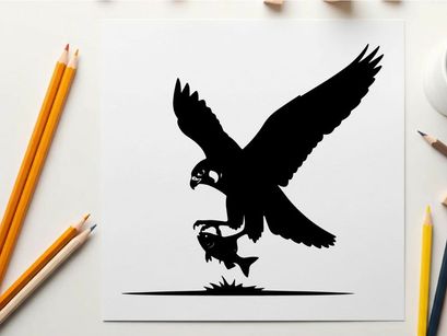 Silhouette of an eagle catching a fish in mid air