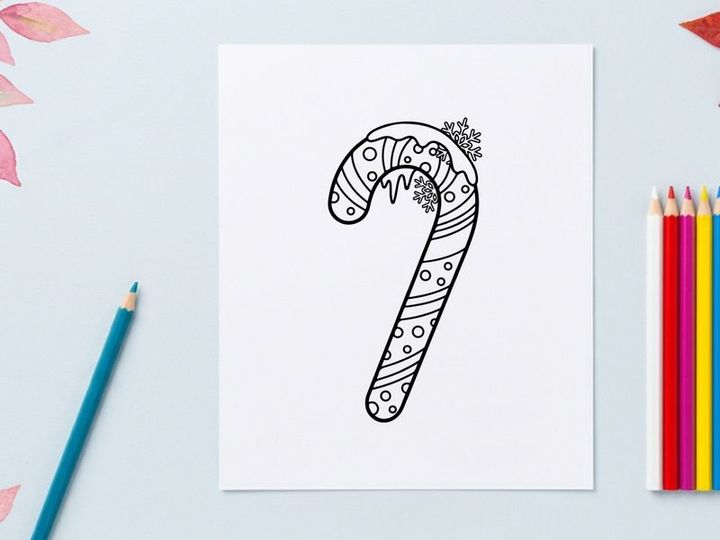 Hand-drawn candy cane with snowflakes for festive Christmas holiday celebration decor
