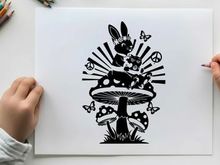 Whimsical silhouette of a bunny on a mushroom with butterflies