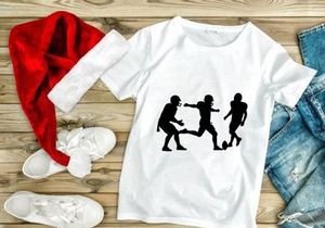 Silhouette of three soccer players in action on the field