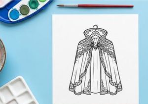 Elegant white fur cape with intricate embroidery for luxury fashion. Stylish faux fur winter cloak for high-end editorial and commercial use.
