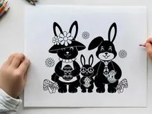 Silhouette of three adorable rabbits with floral accessories