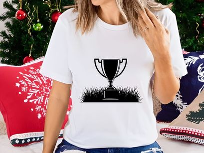 A black and white illustration of a trophy cup on grass