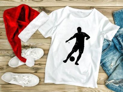 Soccer player kicking a ball in motion