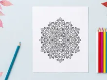Intricate black and white snowflake mandala illustration for Christmas holiday design.