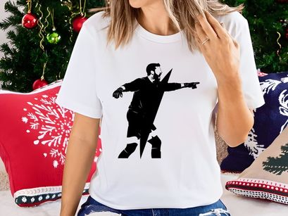 A man in a dynamic pose with arms outstretched and pointing to the right side