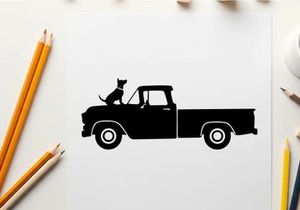 Silhouette of a cat sitting in a vintage pickup truck