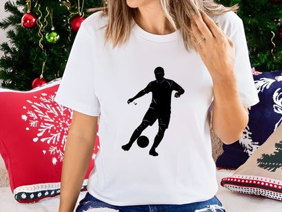 Soccer player kicking a ball in motion