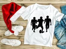 Three silhouette football players in action running with ball