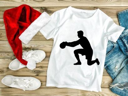 A silhouette of a man in a kneeling position holding a ball