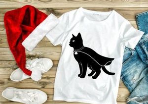 Black cat in cape and shamrock charm