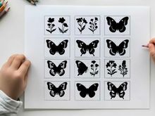 Silhouette of butterflies and flowers in grid pattern silhouette