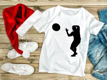 A silhouette of a person catching a ball in mid air with athletic movement and focus