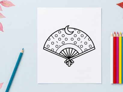 Hand holding decorative Halloween paper fan. Spooky party accessory with ghost and polka dot design for festive celebrations.